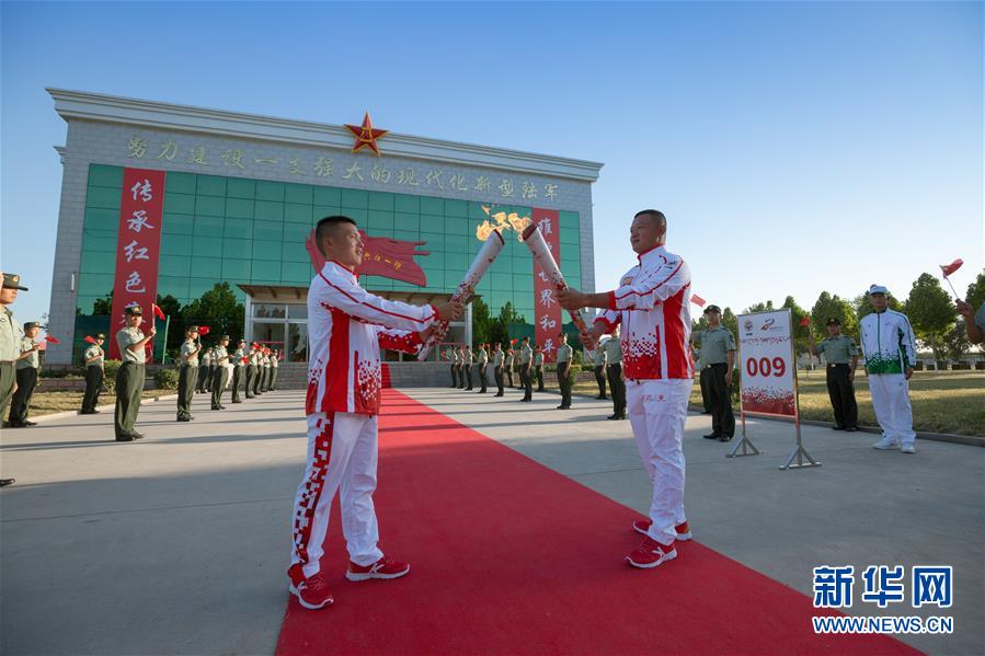 （体育）（3）第七届世界军人运动会火炬传递活动第二站在“开国大典红一师”举行