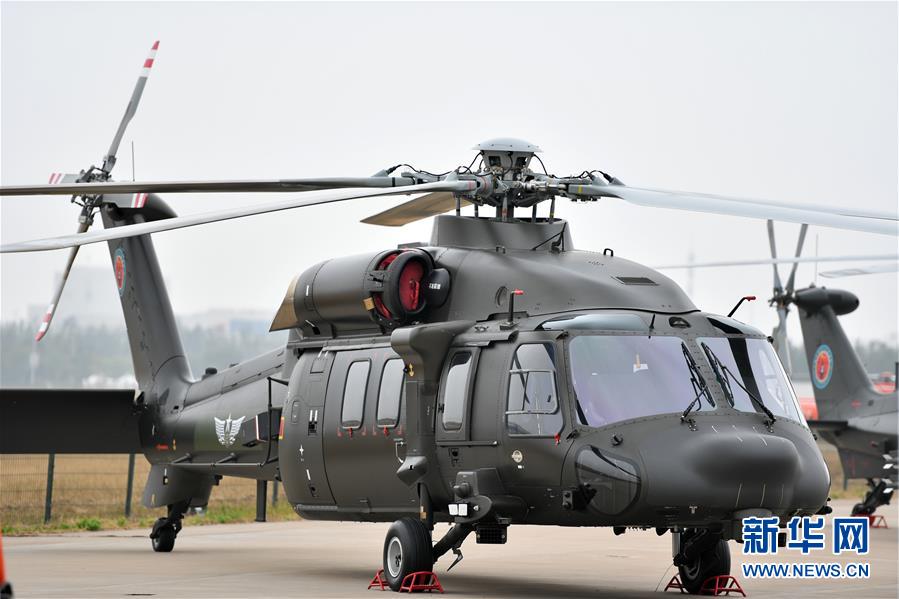 我国自主研制的直20多用途直升机亮相天津直博会
